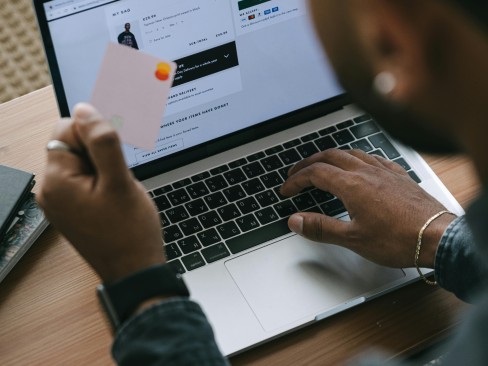 Man making a purchase on a laptop